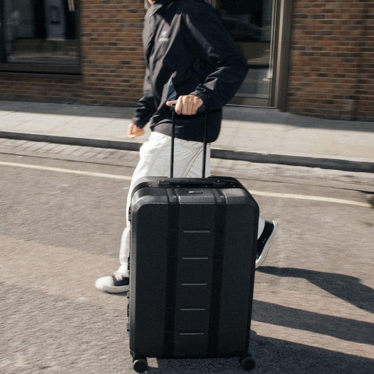 D_b_ Ramverk Pro Large Check-In 28 Inch Hardside Luggage Extra Protection Aluminum Frame, Silent 360 Spinner Wheels, TSA Lock, Interior Laptop Compartment and Two Zipper Dividers - Black Frame/Black