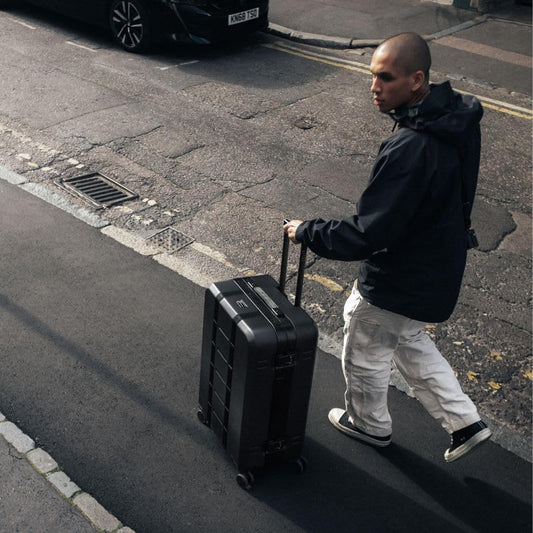 D_b_ Ramverk Pro Medium Check-In 25 Inch Hardside Luggage Extra Protection Aluminum Frame, Silent 360 Spinner Wheels, TSA Lock, Interior Laptop Compartment - Black Frame/Black