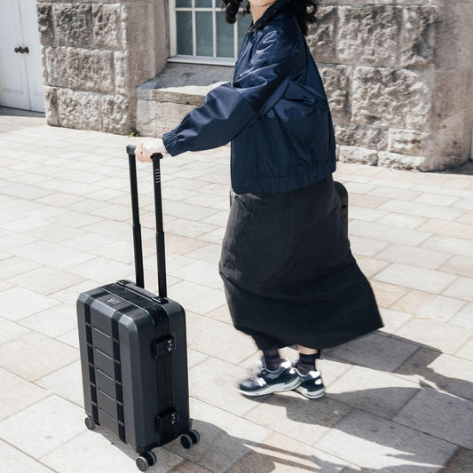 D_b_ Ramverk Pro Carry-On 21 Inch Hardside Luggage Extra Protection Aluminum Frame, Silent 360 Spinner Wheels, TSA Lock, Interior Laptop Compartment and Two Zipper Dividers - Black Frame/Black