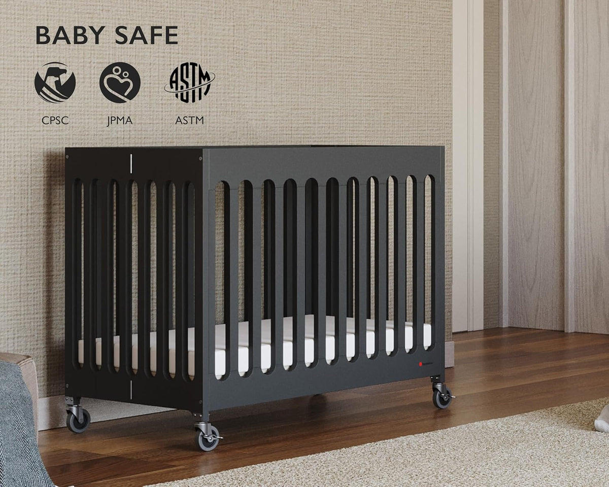 Foundations Boutique Folding Mini Baby Crib - Compact, Portable, Wooden Hotel Crib, Foldable Mini Crib for Baby & Toddlers - Includes 3" Foam Mattress, Ebony