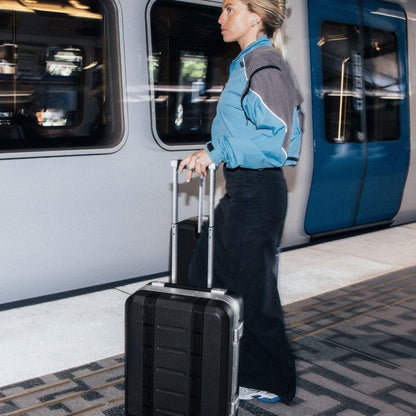 D_b_ Ramverk Pro Carry-On 21 Inch Hardside Luggage Extra Protection Aluminum Frame, Silent 360 Spinner Wheels, TSA Lock, Interior Laptop Compartment and Two Zipper Dividers - Silver Frame/Black