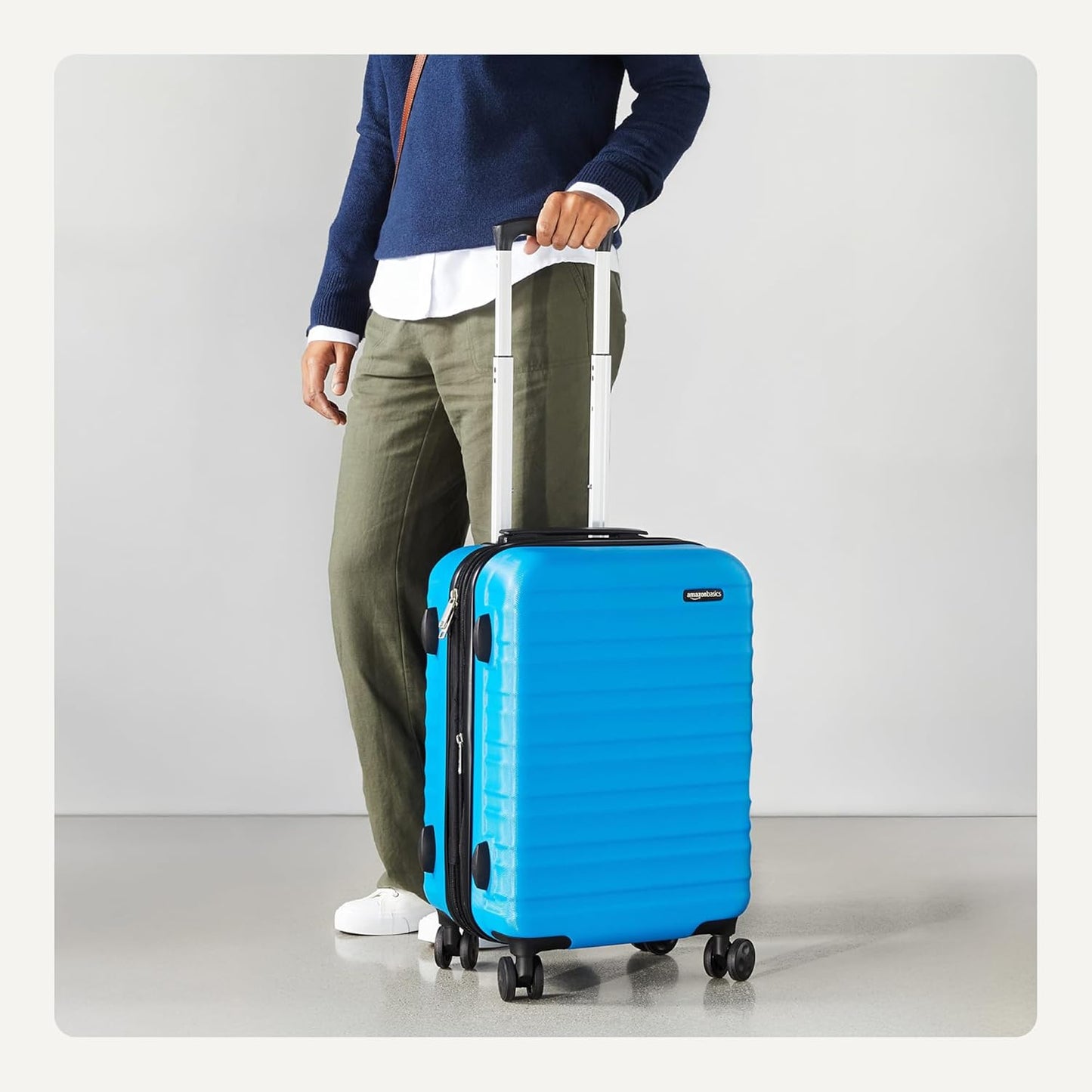 Amazon Basics 21" Hardside Carry-On Luggage, Hardshell Suitcase With Wheels, Expandable For Up to 25% More Space, With Scratch-Resistant Surface, Four Multi-directional Wheels, Light Blue