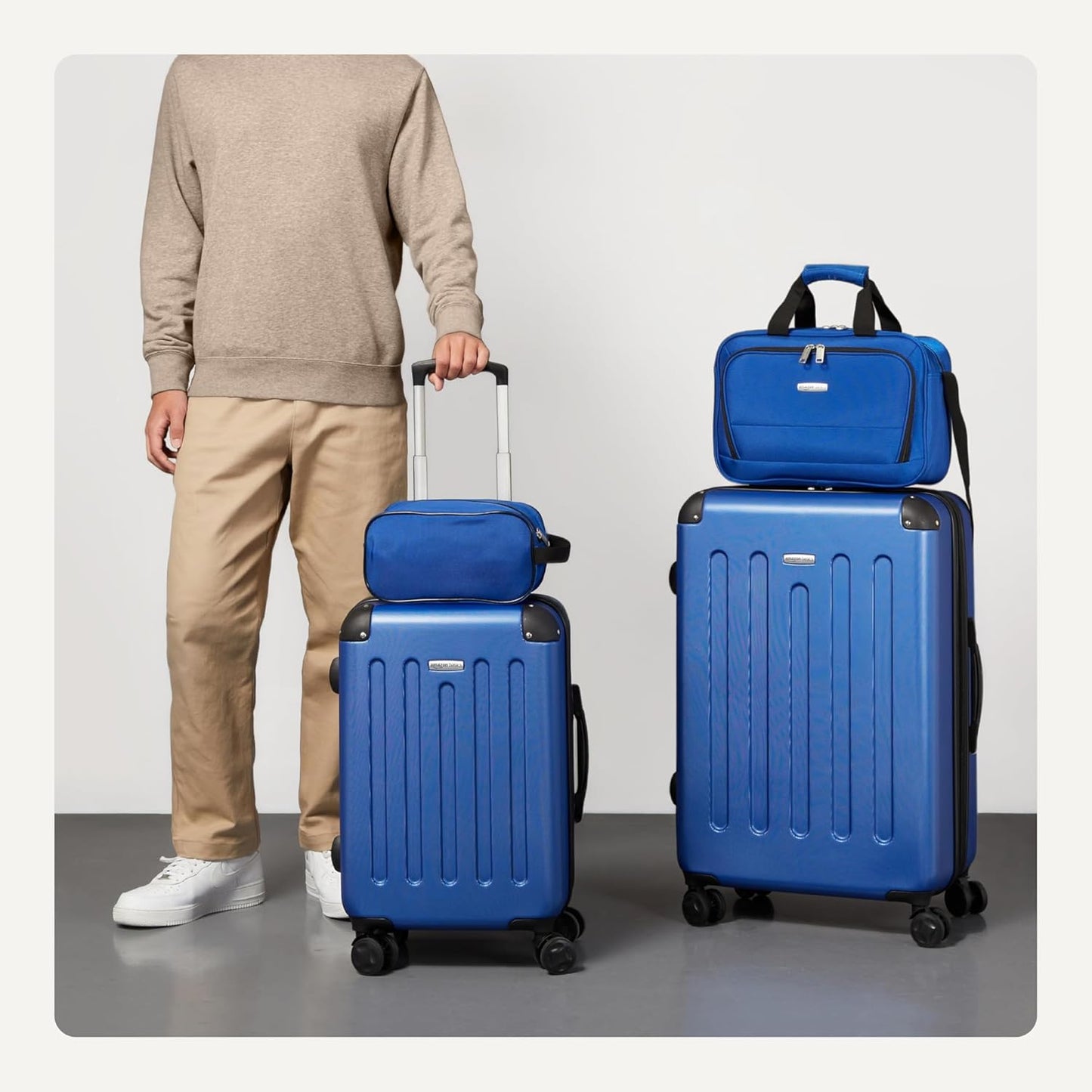 Amazon Basics 4-Piece Luggage Set, Including Two Hardside Suitcases With Multi-directional Spinner Wheels (22" Carry-On and 28" Checked), 15" Tote Bag and 10" Compact Travel Bag, Navy Blue