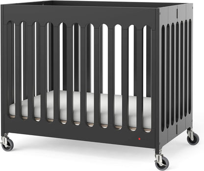 Foundations Boutique Folding Mini Baby Crib - Compact, Portable, Wooden Hotel Crib, Foldable Mini Crib for Baby & Toddlers - Includes 3" Foam Mattress, Ebony