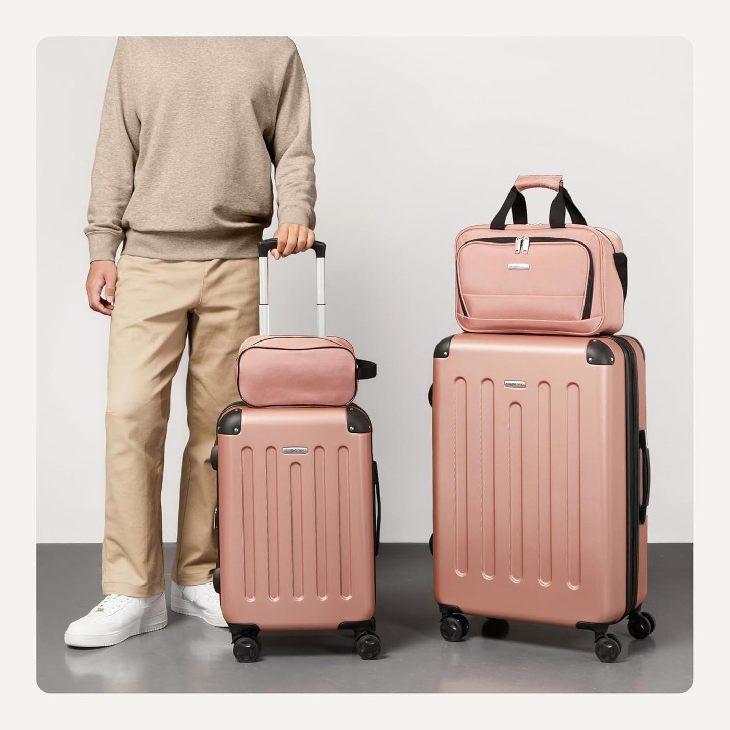 Amazon Basics 4-Piece Luggage Set, Including Two Hardside Suitcases With Multi-directional Spinner Wheels (22" Carry-On and 28" Checked), 15" Tote Bag and 10" Compact Travel Bag, Rose Gold
