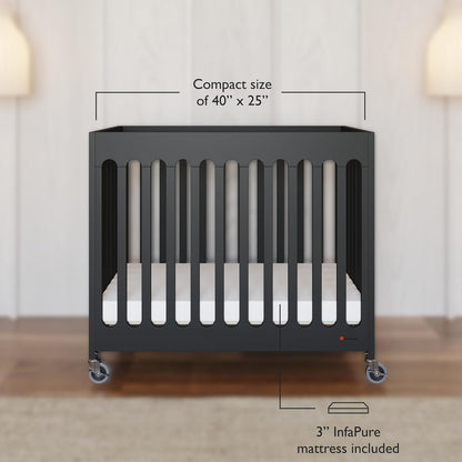 Foundations Boutique Folding Mini Baby Crib - Compact, Portable, Wooden Hotel Crib, Foldable Mini Crib for Baby & Toddlers - Includes 3" Foam Mattress, Ebony