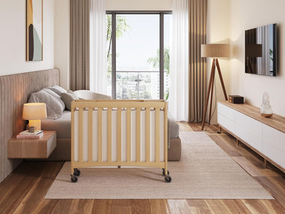 Foundations Travel Sleeper Wood Compact Folding Crib with 2” InfaPure Foam Crib Mattress and Commercial Grade Casters for Hotels, Natural
