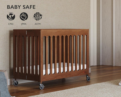 Foundations Boutique Folding Mini Baby Crib - Compact, Portable, Wooden Hotel Crib, Foldable Mini Crib for Baby & Toddlers - Includes 3" Foam Mattress, Cherry