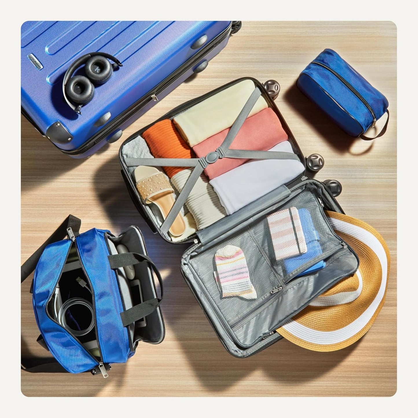 Amazon Basics 4-Piece Luggage Set, Including Two Hardside Suitcases With Multi-directional Spinner Wheels (22" Carry-On and 28" Checked), 15" Tote Bag and 10" Compact Travel Bag, Navy Blue