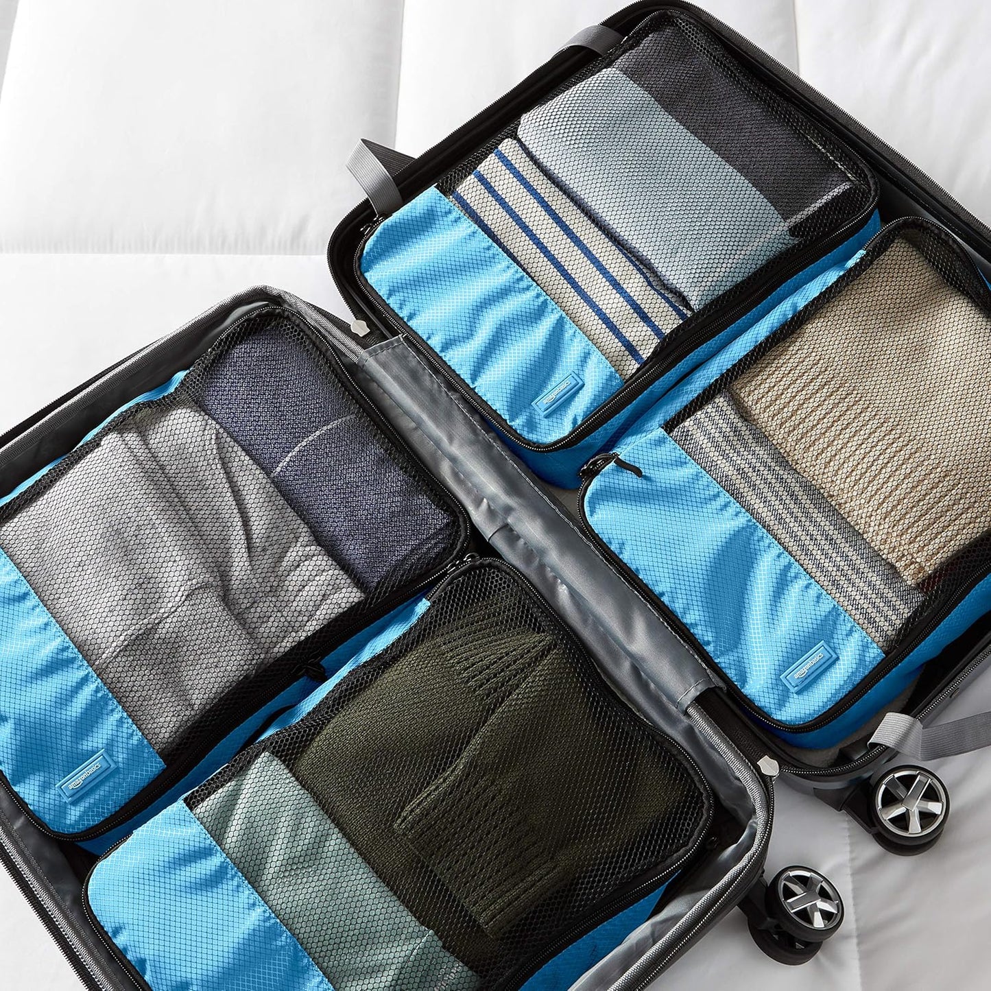 Amazon Basics Medium Packing Cubes for Travel, Packing Organizers, 4-Piece-Set With Double Zipper Pulls and Mesh Top Panel, 100% Durable Polyester, Sky Blue, 13.8"L x 9.8"W x 3"H